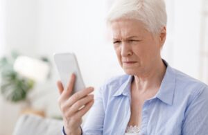 Elderly women having trouble focusing her vision